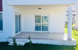 Комфортабельная квартира 2+1 с террасой и выходом в сад на берегу Средиземного моря в районе Бодрум за $253 000
