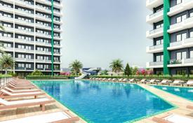 Двухкомнатные апартаменты в комплексе с бассейном и спортивными площадками, 1 км до моря и пляжей, Мерсин, Турция за От $68 000
