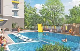Новые квартиры с балконами в охраняемой резиденции с бассейнами, садом и аквапарком, в 120 метрах от пляжа, Махмутлар, Турция за $291 000