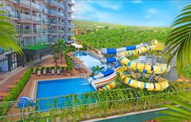 Резиденция с бассейнами, аквапарком и спа-центром в 80 метрах от моря, Мерсин, Турция за От $102 000